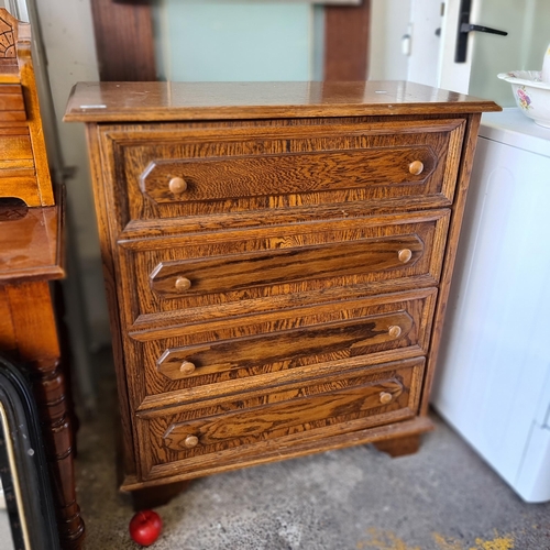 909 - An early twentieth century, oak shoe cabinet. Cleverly disguised as a chest of drawers with a false ... 