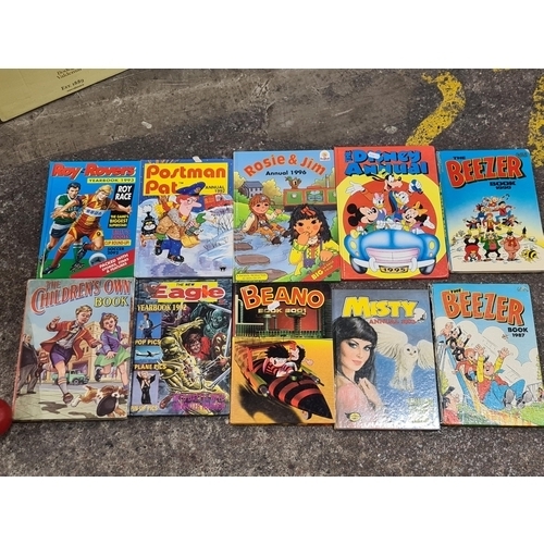 876 - A collection of 10 vintage childrens annuals including the Beano Book, The New Eagle Yearbook 1992, ... 