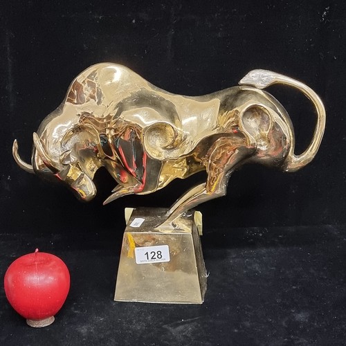 128 - Star Lot : A striking large polished heavy brass sculpture depicting a raging bull on a plinth. Grea... 