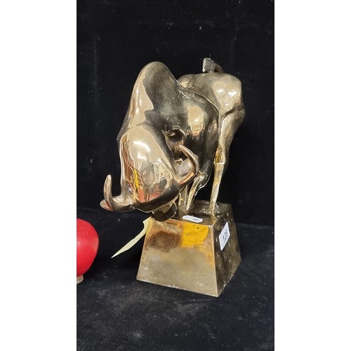 128 - Star Lot : A striking large polished heavy brass sculpture depicting a raging bull on a plinth. Grea... 