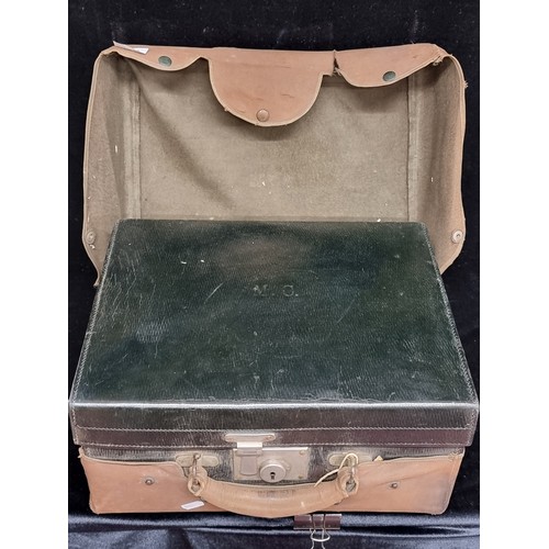 148 - Star lot : An exquisite early 20th century travel vanity case. Crafted from leather, with a heavy wo... 