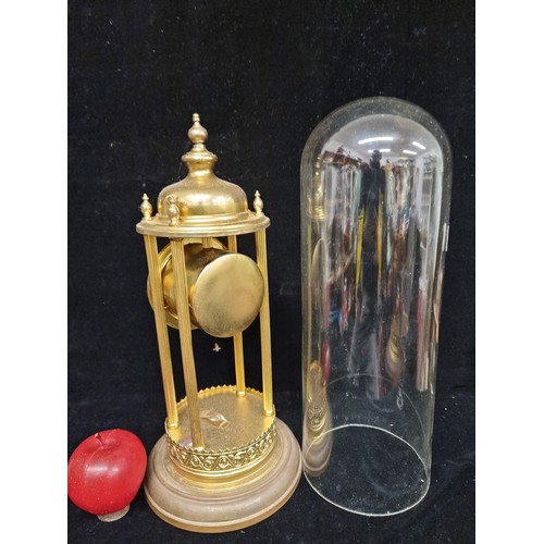 182 - Star lot : A large antique German very elegant, brass toned dome clock. Complete with glass dome, in... 