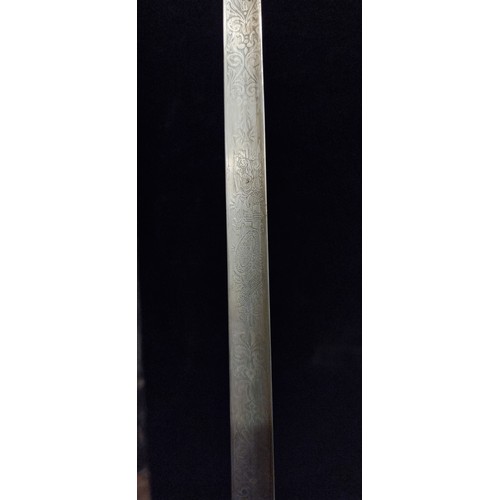 878 - A handsome antique clochemarde sword with metal hilt, incised baroque foliate ornament to blade and ... 