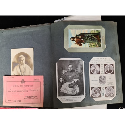 306 - A postcard album housing over 200 antique and vintage postcards and ephemera of religious interest, ... 