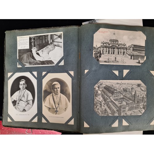 306 - A postcard album housing over 200 antique and vintage postcards and ephemera of religious interest, ... 