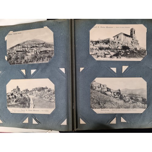 306 - A postcard album housing over 200 antique and vintage postcards and ephemera of religious interest, ... 