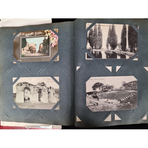 306 - A postcard album housing over 200 antique and vintage postcards and ephemera of religious interest, ... 