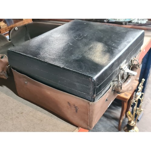 148 - Star lot : An exquisite early 20th century travel vanity case. Crafted from leather, with a heavy wo... 