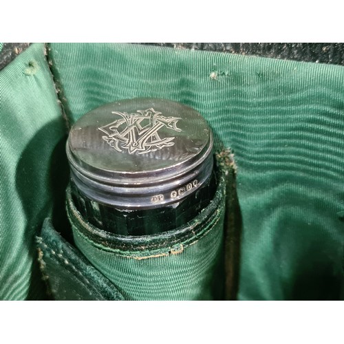 148 - Star lot : An exquisite early 20th century travel vanity case. Crafted from leather, with a heavy wo... 