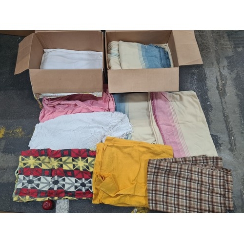 904 - Two Large  boxes filled with a nice collection of  vintage Irish blankets including knitted and wool... 