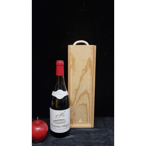 116 - A sealed 75cl bottle of 2019 Beaujolais Villages red wine. In a wooden presentation box.