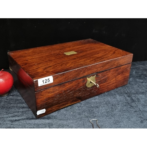 125 - A very handsome antique rosewood writing box, fitted internally with a leather slope, ink well compa... 