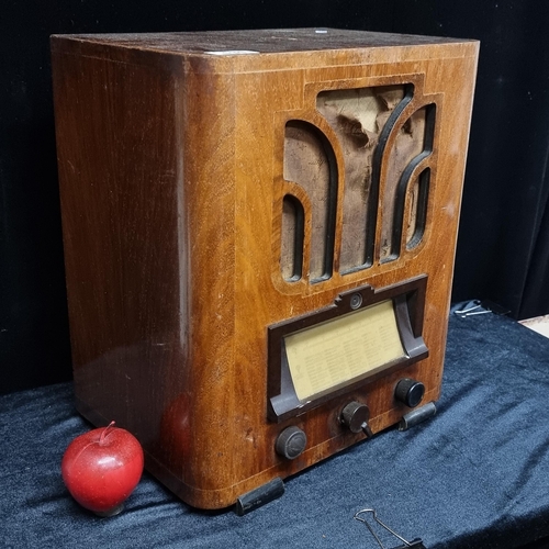 131 - A fabulous antique radio with a golden mahogany case of wonderful Art Deco form. Included are three ... 