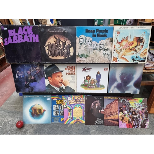 142 - A selection of 13 vintage vinyl albums. Including artists such as Black Sabbath, Deep Purple, Dire S... 