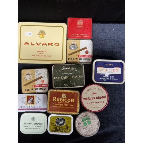 153 - A selection of 12 vintage advertising tins for tobacco, cigars and cigarettes. Including Benson & He... 