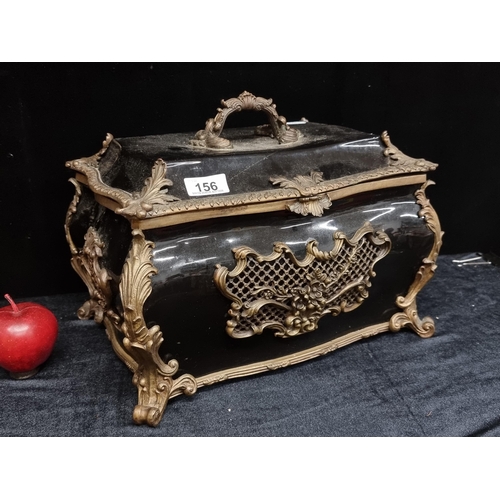 156 - A fabulous large porcelain lidded palace jewellery  box. With a glossy black glaze and profuse ormol... 