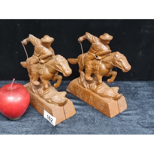 162 - A pair of heavy, cast metal, advertising bookends for Winchester rifles. Featuring the iconic horse ... 