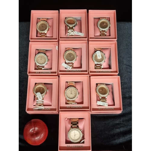 163 - A selection of ten ''NY London'' ladies wrist watches in a rose gold tone, with diamante bezel. Comp... 