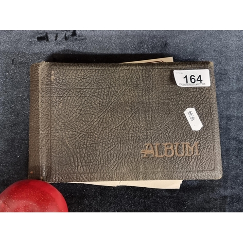 164 - A charming Edwardian postcard album. Partially filled with a mixture of Edwardian and mid twentieth ... 