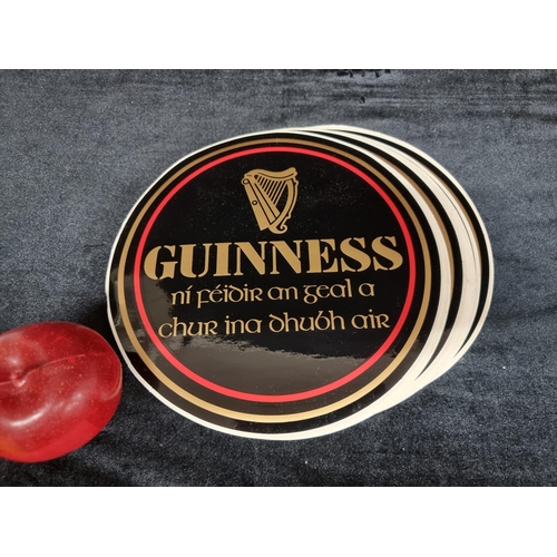 186 - Approx 70 vintage Guinness branded stickers. These are attractive circular designed stickers in the ... 