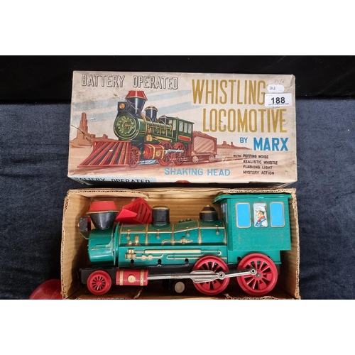 188 - A vintage large tin plate battery-operated Whistling Locomotive by Marx toy company with puffing noi... 