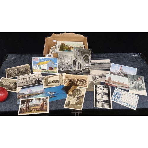 232 - A big box of vintage postcards including Irish, examples.