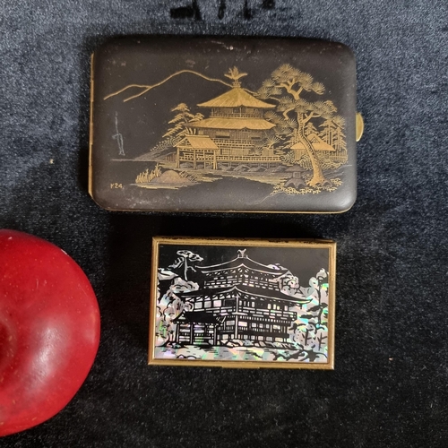 240 - Two vintage items, including a Japanese powder compact and music box with a mother of pearl temple s... 