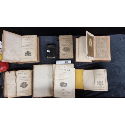 257 - A selection of seven antique books of a religious theme, including bibles, missals, and a Catholic p... 