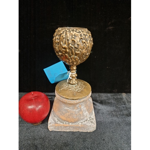 260 - Star lot : A very heavy antique bronze chalice with a wax-drip effect design, mounted on a terracott... 