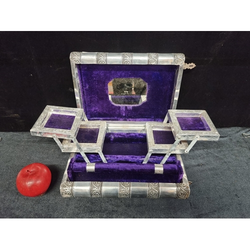 262 - A vintage open-out jewellery box book, featuring tiered compartments, plush purple velvet interior a... 