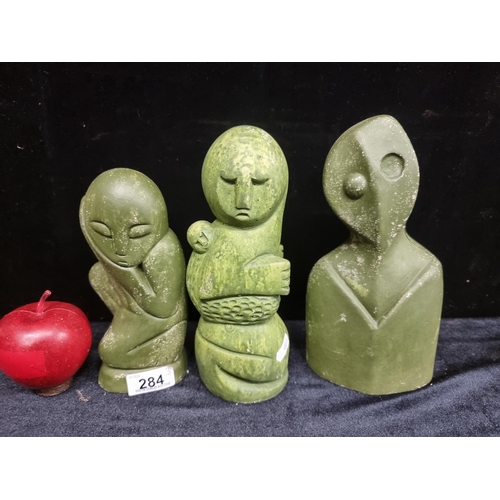 284 - Three figurative Irish sculptures with a green finish. The figures are modelled with attention paid ... 