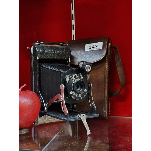 347 - A vintage Kodak folding camera model A120 with a branded Kodak leather travel case (circa 1922)