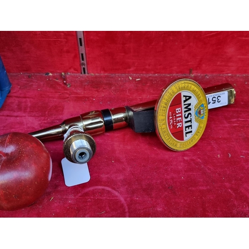 351 - An Amstel Bier beer tap. Complete with a fish-eye badge, nozzle, locknut and John Guest fitting. In ... 