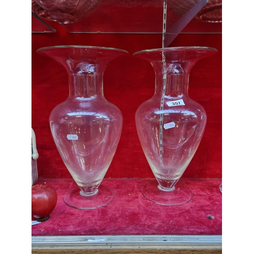 357 - A large pair of handblown glass urn vases. In good condition with a striking classical form. H38cm