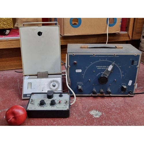 363 - Three vintage technical instruments. Including a Windsor model 190A Audio Oscillator, a Phillips mod... 