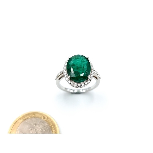 438 - Super Star Lot: An exceptional example of an oval Emerald and Diamond 14 carat white Gold ring, whic... 