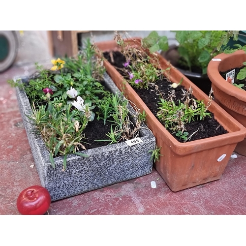 455 - Two very high quality rectangular stoneware planters, with a long example in an orange shade with ca... 