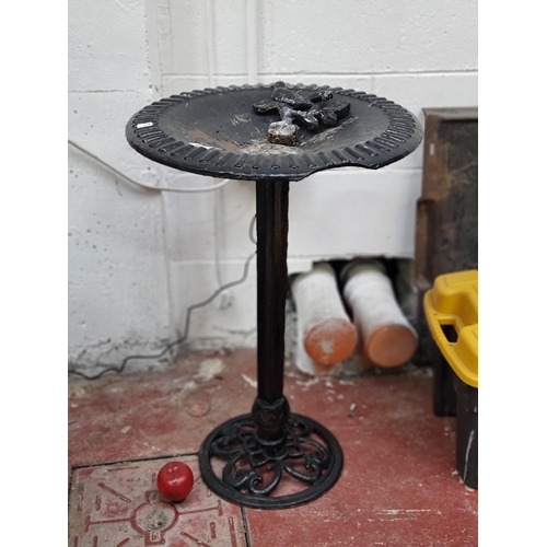 462 - A wonderful cast metal bird bath, with a textured edge and wonderfully ornate open work base. H: 73c... 