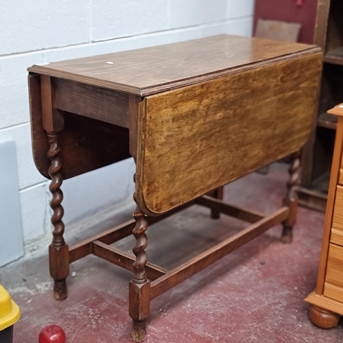 463 - A very characterful antique drop leaf table, with elaborately turned barley twist legs  H: 73cm X W:... 