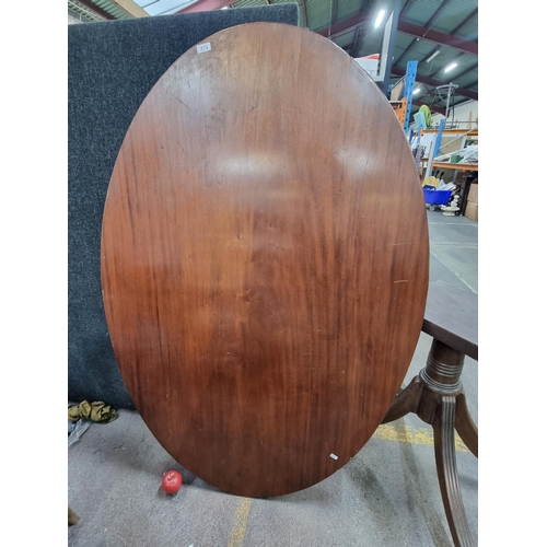 474 - A lovely Victorian Mahogany oval table, set upon a plinth base with four legs ending in brass tipped... 