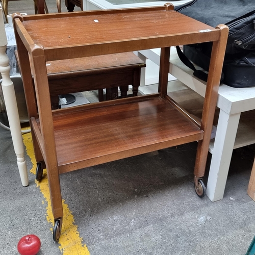 497 - A vintage two tier drinks trolley, held on original castors.