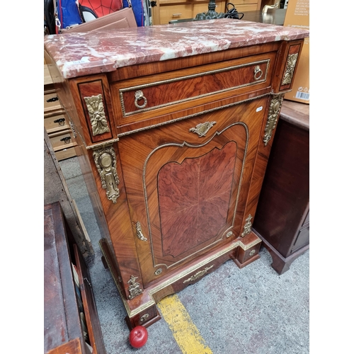 548 - Star lot : An elegant French style drinks cabinet with a bevelled red cold marble top with white vei... 