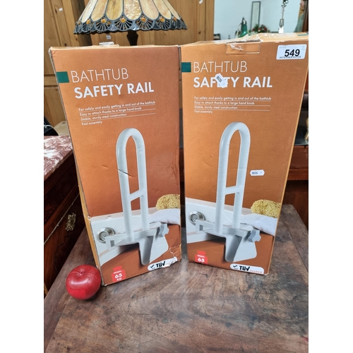 549 - A pair of bathtub safety rails. To support a maximum of 65kg. Brand new, old stock.