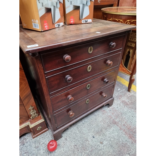 550 - An unusual commode  in the form of an antique chest with four drawers with a false facade. Complete ... 