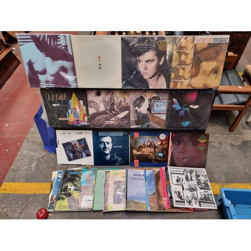 555 - A collection of 42 vinyl record albums including the Smiths, Elton John, Van Morrison and Paul Young... 