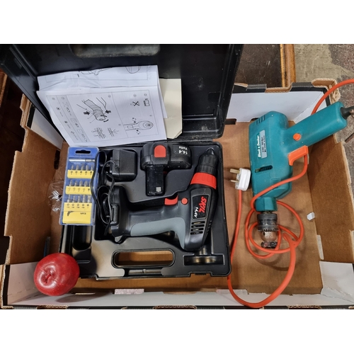 557 - Two electric drills including a Skill 14.4 volt cordless drill and a Black and Decker 500 watt drill... 