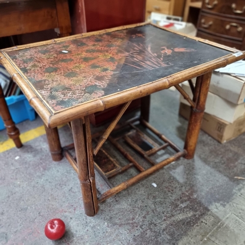 559 - An amazing antique bamboo coffee table with stunning hand painted scene to top, consisting of flower... 