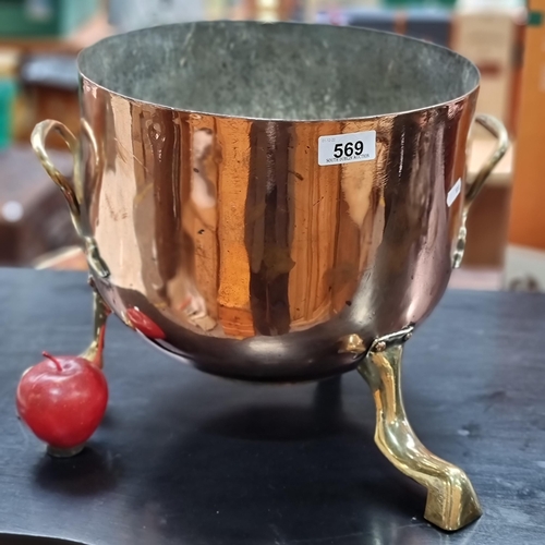 569 - Star Lot : A very heavy copper Georgian,  brass and copper tripod cauldron with handles to side. Nic... 