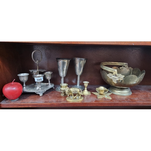 598 - A mixed lot of nine items included an antique, plated egg server, a pair of silver-plated Spanish go... 