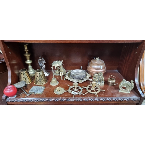 599 - A large collection of vintage brassware, including a kangaroo figure, a centrepiece ashtray and many... 